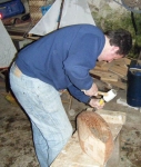 Douglas helps on the chiselling of Marianne's hull. Photo: MG